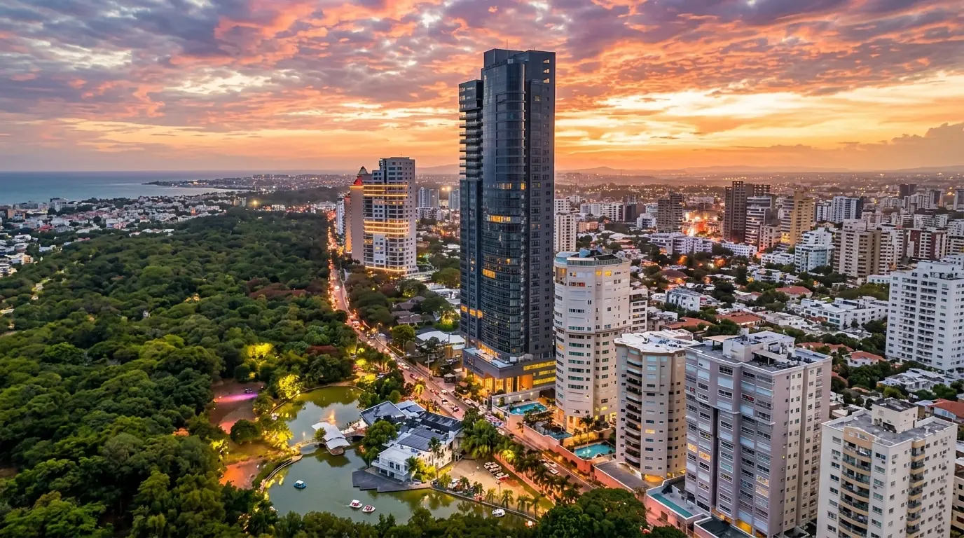 Santo Domingo at sunset, its towers beside a large park
